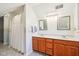 Bright bathroom featuring a double sink vanity, and two mirrors at 520 Denny Dr, Mooresville, IN 46158