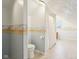 Bright bathroom featuring a bathtub with shower and stylish wall design at 520 Denny Dr, Mooresville, IN 46158