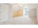 Spacious bedroom with carpet floors, a window, and a closet at 520 Denny Dr, Mooresville, IN 46158