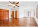 Bedroom featuring hardwood floors, a ceiling fan, closet and natural light from the windows at 520 Denny Dr, Mooresville, IN 46158