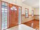 Inviting front entrance showcasing a beautiful wooden door with sidelights and tile flooring at 520 Denny Dr, Mooresville, IN 46158