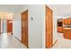 Hallway showing tile flooring, doors, and entry to other rooms at 520 Denny Dr, Mooresville, IN 46158
