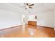 Open living room with hardwood floors and a view into the kitchen at 520 Denny Dr, Mooresville, IN 46158
