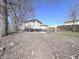 Backyard features a swimming pool and fencing, and mature trees at 632 Middleham Cir, Beech Grove, IN 46107
