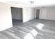 Bright basement with gray modern flooring and neutral walls, offering a versatile living space at 632 Middleham Cir, Beech Grove, IN 46107