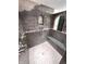 Elegant walk-in shower featuring a built-in seat, niche, and modern fixtures for a spa-like experience at 632 Middleham Cir, Beech Grove, IN 46107