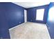 An inviting bedroom with a neutral carpet and a large window for plenty of natural light at 632 Middleham Cir, Beech Grove, IN 46107