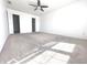 Spacious bedroom with carpeting, a ceiling fan, and natural light, offering ample closet space at 632 Middleham Cir, Beech Grove, IN 46107