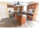 Modern kitchen featuring stainless steel appliances, granite countertops, and center island at 632 Middleham Cir, Beech Grove, IN 46107