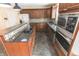 Modern kitchen featuring stainless steel appliances, granite countertops, and ample cabinet space at 632 Middleham Cir, Beech Grove, IN 46107