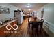 Dining area adjacent to the kitchen featuring wood floors and natural light at 6721 Jackson St, Anderson, IN 46013