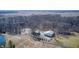 An aerial view showing the property's layout, including the house, pond, driveway, and surrounding land at 7143 W 50 S, Morgantown, IN 46160