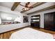 Charming bedroom featuring wood beams, a cozy nook, and a spacious dresser, adding rustic elegance to a modern design at 7143 W 50 S, Morgantown, IN 46160