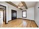 Spacious bedroom with exposed beams, hardwood floors, and a window offers a versatile space for rest and relaxation at 7143 W 50 S, Morgantown, IN 46160