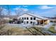 Expansive home featuring a patio, hot tub, and sleek, modern design with ample windows for natural light at 7143 W 50 S, Morgantown, IN 46160