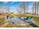 Outdoor oasis featuring a fire pit, seating, and landscaped walkway, ideal for cozy gatherings at 7143 W 50 S, Morgantown, IN 46160