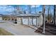 Detached two-car garage offering ample parking and storage space surrounded by beautiful landscape and trees at 7143 W 50 S, Morgantown, IN 46160