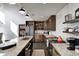 A modern kitchen with stainless steel appliances, granite countertops, and rustic wood cabinets and open shelving at 7143 W 50 S, Morgantown, IN 46160