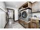 Convenient laundry room equipped with modern washer and dryer, cabinets, and counter space at 7143 W 50 S, Morgantown, IN 46160
