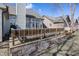 Backyard view with wooden deck and a natural setting with a partial view of the home at 7195 Koldyke Dr, Fishers, IN 46038