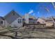 Inviting backyard featuring well-maintained lawn, deck, and serene landscaping at 7195 Koldyke Dr, Fishers, IN 46038