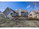 Lovely backyard featuring a well-maintained lawn, wooden deck, and serene landscaping at 7195 Koldyke Dr, Fishers, IN 46038