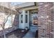 Welcoming front entrance featuring an elegant door with sidelights and a brick facade at 7195 Koldyke Dr, Fishers, IN 46038