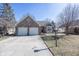 Charming brick home featuring a two-car garage and well-maintained landscaping at 7195 Koldyke Dr, Fishers, IN 46038