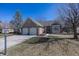 Attractive brick home with manicured front lawn, two-car garage and established trees at 7195 Koldyke Dr, Fishers, IN 46038