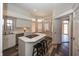 Bright kitchen with an island cooktop, stainless steel appliances, and plenty of windows at 7195 Koldyke Dr, Fishers, IN 46038