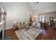 Spacious living room with hardwood floors, a fireplace and ample seating at 7195 Koldyke Dr, Fishers, IN 46038
