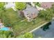 Aerial view of a backyard featuring a deck, a pond, and an expansive lawn at 7645 Ballinshire N, Indianapolis, IN 46254