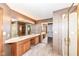 Dual sink bathroom vanity, complemented by a large mirror and a glass door walk-in shower at 7645 Ballinshire N, Indianapolis, IN 46254