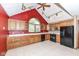 Spacious kitchen with oak cabinets, tile flooring, and black appliances at 7645 Ballinshire N, Indianapolis, IN 46254