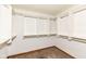 Organized walk-in closet with built-in shelves and hanging rods, maximizing storage space at 7645 Ballinshire N, Indianapolis, IN 46254