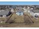 Home's backyard with a fence surrounding the perimeter in a residential neighborhood at 7675 Winding Lake S Dr, Noblesville, IN 46062