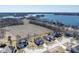 Stunning aerial view of a lakeside home and its surrounding community at 7675 Winding Lake S Dr, Noblesville, IN 46062