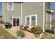 Relaxing back patio with outdoor seating, a grill, and a view of the backyard at 7675 Winding Lake S Dr, Noblesville, IN 46062