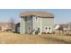 The backyard features a patio with a grill and outdoor seating surrounded by a fenced yard at 7675 Winding Lake S Dr, Noblesville, IN 46062