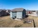 Home's backyard with a small porch and a BBQ, surrounded by well-maintained lawn at 7675 Winding Lake S Dr, Noblesville, IN 46062
