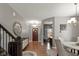 Inviting home entryway featuring hardwood floors, and access to the dining room and office at 7675 Winding Lake S Dr, Noblesville, IN 46062