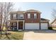 Charming two-story home featuring brick and siding, a welcoming front porch, and a spacious three-car garage at 7675 Winding Lake S Dr, Noblesville, IN 46062