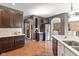 Modern kitchen featuring stainless steel appliances and easy access to an open-concept living area at 7675 Winding Lake S Dr, Noblesville, IN 46062