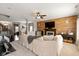 Comfortable living room featuring modern fireplace with accent wall and stairway access at 7675 Winding Lake S Dr, Noblesville, IN 46062