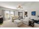 Inviting living room with large windows, comfortable seating, and neutral color scheme at 7675 Winding Lake S Dr, Noblesville, IN 46062