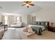 Spacious main bedroom featuring vaulted ceilings, sitting area, natural light, and a cozy, airy feel at 7675 Winding Lake S Dr, Noblesville, IN 46062