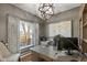 Stylish office space with a unique light fixture, modern desk, and a world map at 7675 Winding Lake S Dr, Noblesville, IN 46062