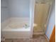 Bright bathroom with tub, separate shower, and neutral tile floors at 777 West St, Whiteland, IN 46184