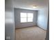 Clean bedroom with fresh paint, new carpet and large window to let in sunlight at 777 West St, Whiteland, IN 46184