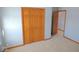 Bedroom showing a double door closet and an open door to the next room at 777 West St, Whiteland, IN 46184